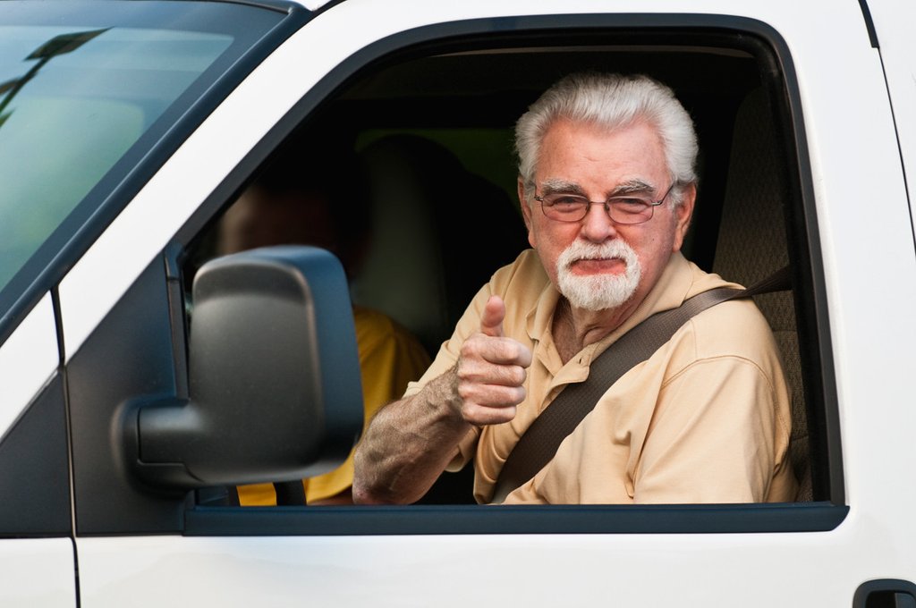 Senior driver checking their Maxi View blind spot mirror